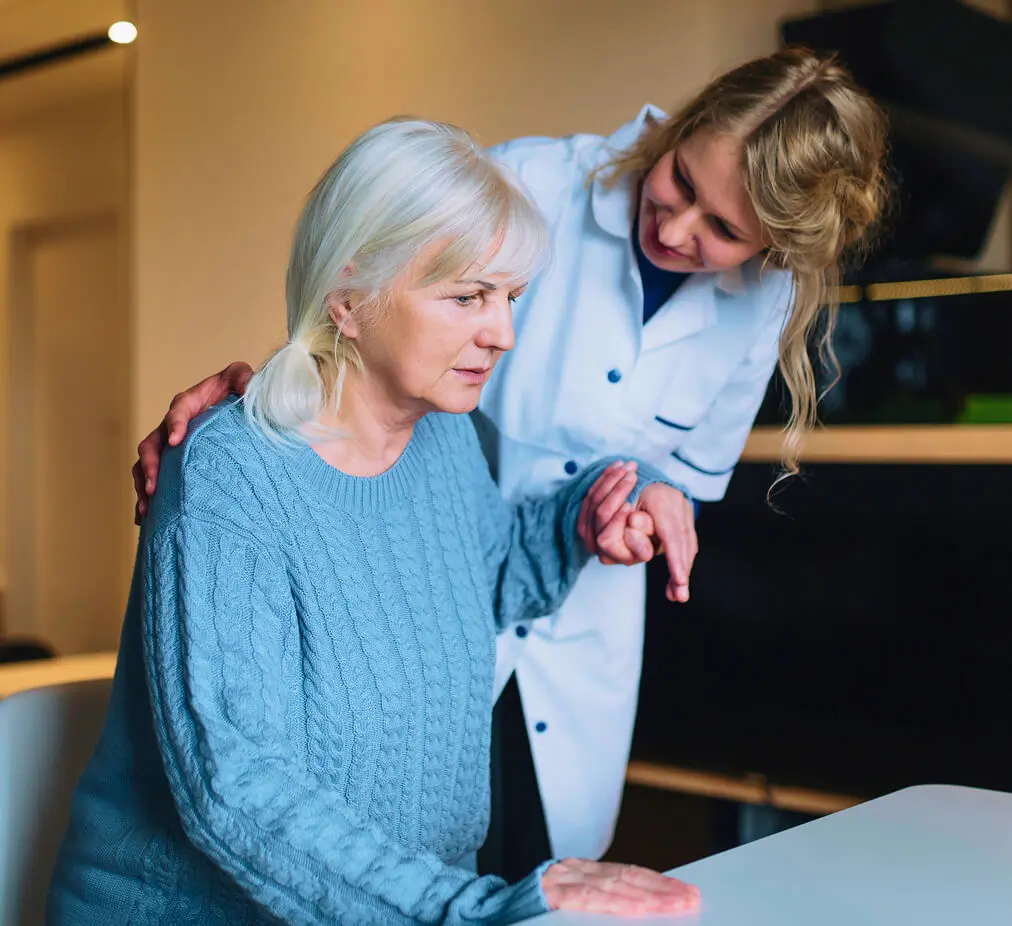 A home health aide supporting a client at home